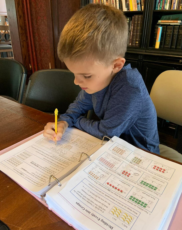 Boy working on math pages
