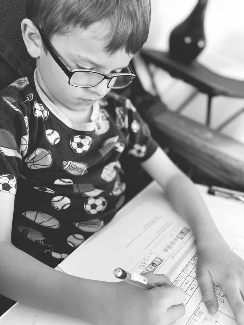 A boy doing a math test