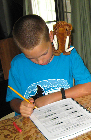 Mathy the mascot on a boy's shoulder