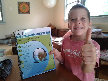 boy with thumbs up for Math Mammoth