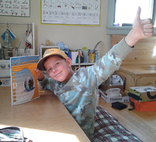 boy with thumbs up for Math Mammoth