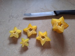 slices of starfruit and knife