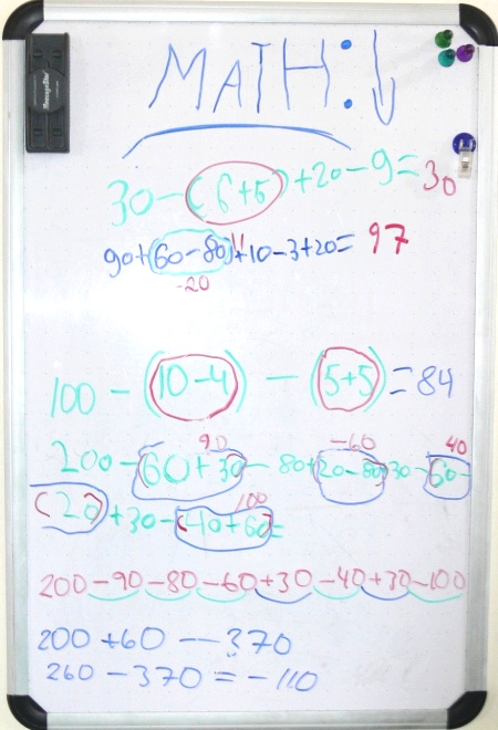 Whiteboard with numbers and math operations